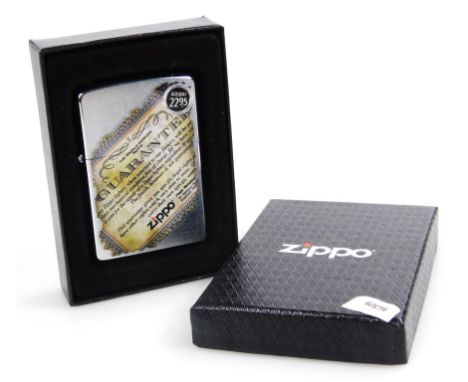 A Zippo American lighter, with transfer guarantee front, 6cm high. (boxed, with papers) 