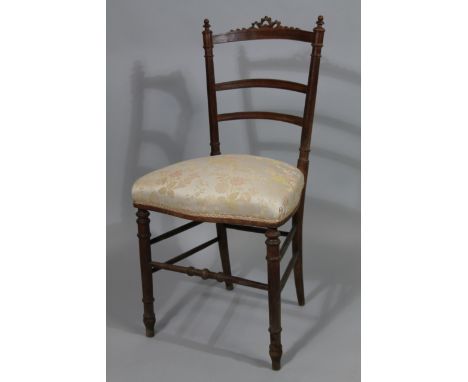 A Victorian stained beech bedroom chair, with a ladder back, turned supports, and padded seat, on tapering legs. 