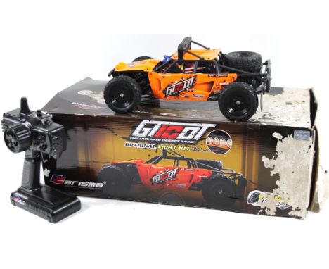 A GTICD Automate Desert Racer light cased remote controlled car, (boxed) and a part boxed Subaru Impreza Colin McRae style ra