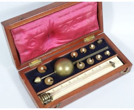 A 19thC Loftus Sikes hydrometer, the mahogany case with hinged lid revealing apparatus with ivory backed thermometer and oute