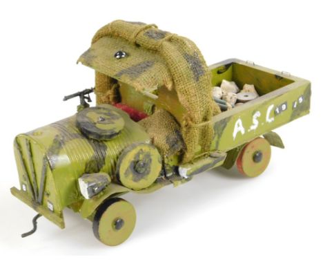 A 20thC wooden and metal model, of an army jeep with hessian style roofing and articulated wheels, 18cm high.