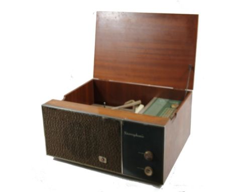 A mid 20thC retro Stereophonic Pye Cambridge radiogram, with record player turn table and radio, with a textured front, artic