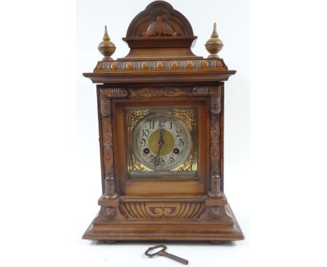 A German walnut late 19thC mantel clock, square brass dial with silvered chapter ring bearing Arabic numerals, 8-day movement