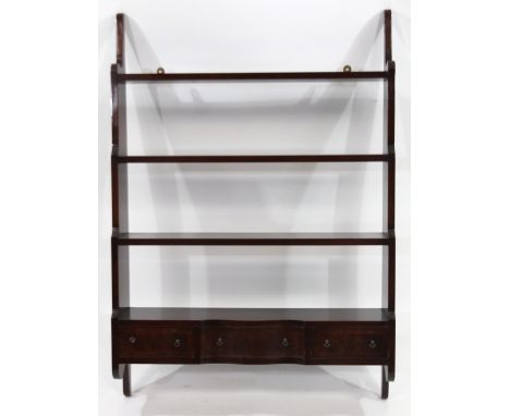 An early 20thC mahogany hanging shelf, with four graduated open shelves above drawers beneath, 112cm H, 77cm W, 20cm D.