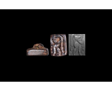 1st millennium BC. A haematite stamp seal engraved with the image of a standing demon with long plait down to the feet, hands