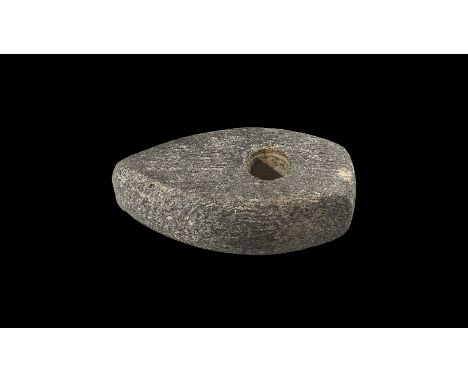 Neolithic, 5th-3rd millennium BC. A ground schist axehead, scaphoid in plan with curved edge, ground central socket, square b