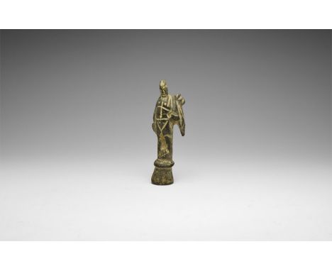 1st-2nd century AD. A bronze statuette of Mercury (Hermes) standing on a base, naked apart from a chlamys over the left shoul