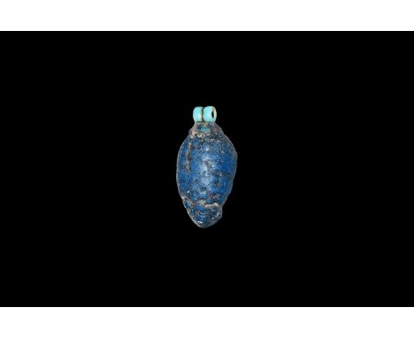 Amarna Period, 1353-1336 BC. A glazed composition amulet of a bunch of grapes with loop to the reverse and double loop to the