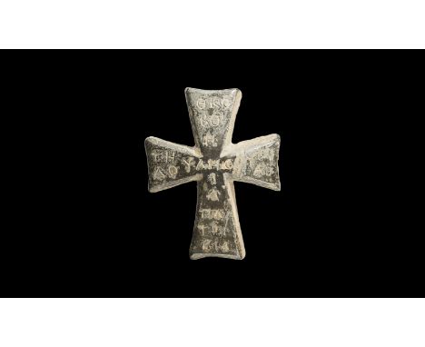 6th-8th century AD. A bronze equal-armed cross with flaring ends; each arm of cross inscribed with Greek text.   122 grams, 5