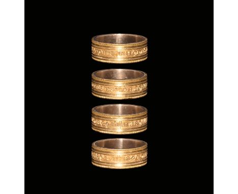 Dated 1804. A flat-section ring comprising a silver core and gold outer sleeve; beaded border and gusseted profile with legen