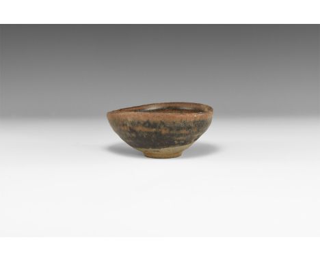 Song Dynasty, 960-1127 AD. A conical ceramic bowl with basal ring, brown 'hare's fur' glaze.   180 grams, 11cm (4 1/4"). Prop