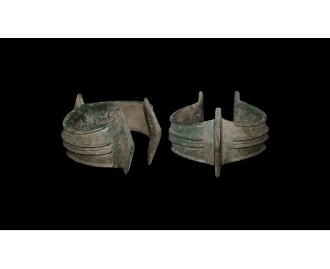 1st millennium BC. A bronze bracelet with scooped edges, doubled ropework borders, median ropework bands, three triangular tr