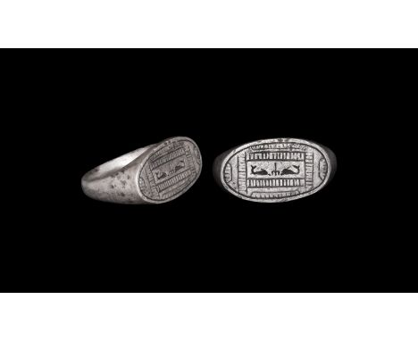 2nd-3rd century AD. A silver ring with D-section shank with expanding shoulder; oval bezel engraved with square frame with tw