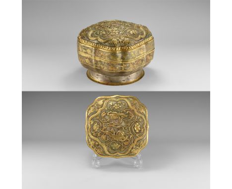 Tang Dynasty, 618-906 AD. A parcel-gilt silvered lidded container with flared foot; the sidewall undulating with band of parc