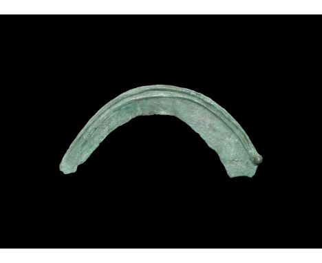2nd millennium BC. A bronze sickle with raised rib on one face to the rear edge and securing bulb.   60 grams, 13.5cm (5 1/4"