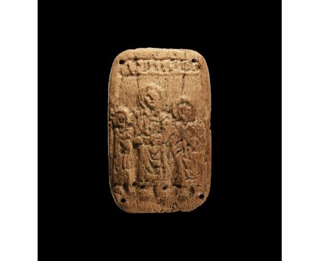 9th-11th century AD. A rectangular bone plaque with rounded corners and securing holes, low-relief image of three facing cloa