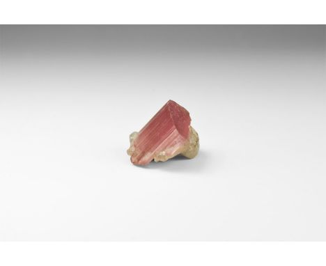 A well-terminated crystal of rubellite tourmaline with classic striated prism faces and accessory quartz, with old Gregory, B