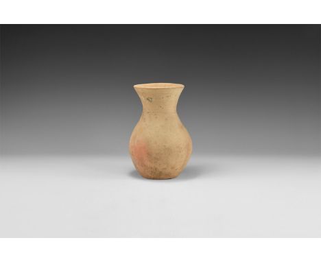 3rd millennium BC. A terracotta biconical jar with broad flared rim.   471 grams, 15.5cm (6"). Property of an Essex gentleman