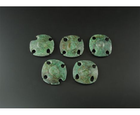 2nd millennium BC. A matched set of bronze fittings, each a domed rectangle with central boss and four circular holes to the 