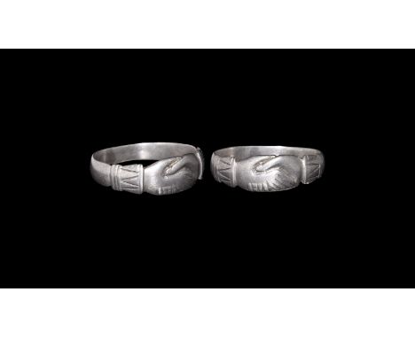 15th century AD. A flat-section silver hoop with bezel formed as clasped hands with ribbed and banded cuffs. Cf. Oman, C.C. V