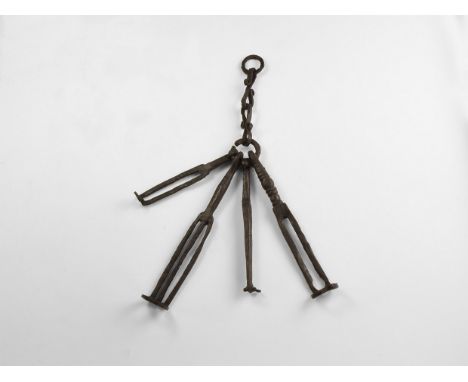 9th-11th century AD. An iron chatelaine with keys; the chain with two s-scrolled links and two rings; a key with scrolled fin