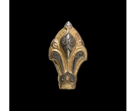 10th-11th century AD. A parcel-gilt silver mount with three pointed lobes, domed median sections with punched-point and niell