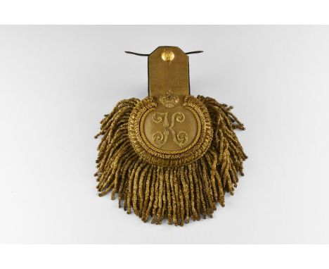 19th century AD. A gilt braid uniform epaulette with embroidered crown over 'K', with gilt button bearing Imperial eagle.   2