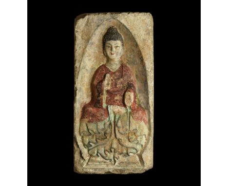 Northern Wei Dynasty, 386-535 AD. A ceramic rectangular brick with pointed arch-shaped recess; within figure of the Buddha se
