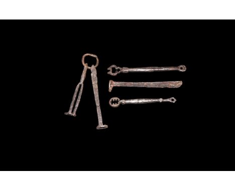 9th-11th century AD. A mixed group of iron keys comprising: two with balustered shaft, voided discoid head; one with flat-sec