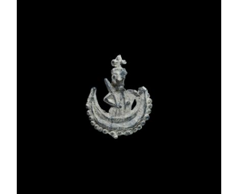 Early 16th century AD. A pewter pilgrim's badge depicting Our Lady of Willesden, crowned and with a sceptre, standing in a cr