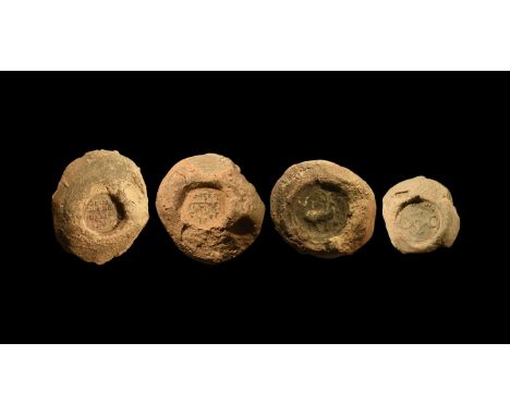 3rd-6th century AD. A group of ceramic stamp impressions comprising: two with Pahlavi inscription, one also with smaller stam