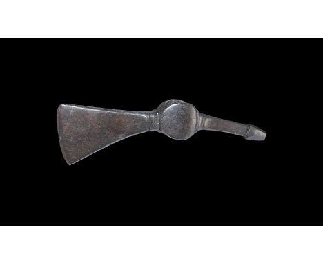 9th-11th century AD. An iron axe-hammer comprising a discoid-profile socket with ribbed collars, trapezoidal blade with curve