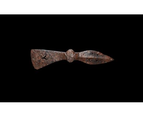 10th-12th century AD. An iron axehead comprising: facetted socket with short flared blade pierced with a 'Y'-shaped void, lea