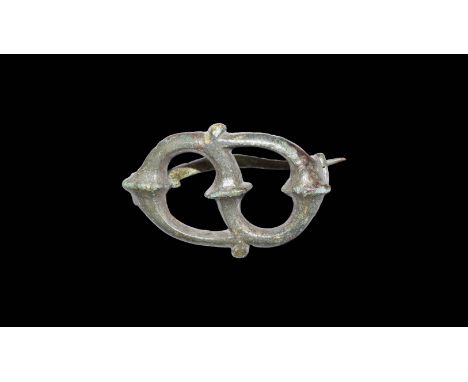 1st century AD. A bronze openwork brooch formed from La Tene 'trumpet swirls', pin and catch plate to the back.   12 grams, 4