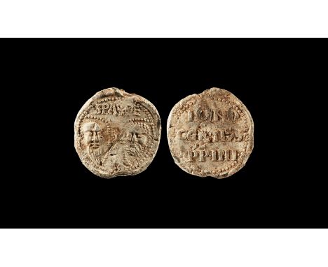 1243-1254 AD. A discoid lead papal bulla of Innocent IV with two bearded faces to one face separated by a cross, 'SPA.SPE' ab