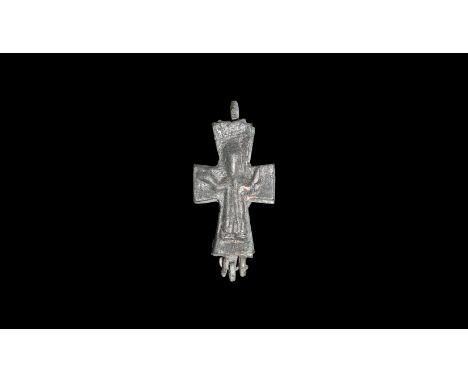 7th-9th century AD. A bronze reliquary cross in two parts and held together by a hinge and suspension loop; both faces with t