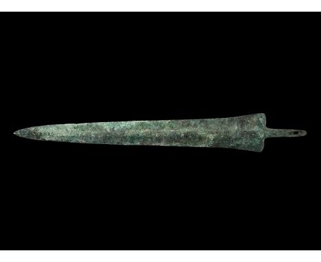 13th-6th century BC. A bronze short sword blade with triangular blade and pierced tang, broad median rib.   290 grams, 36cm (