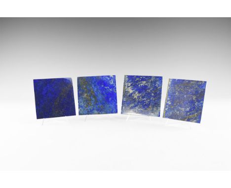 A set of four rectangular coasters of fine quality lapis lazuli, approximately 3mm thick, from Chile. See Bonewitz, Dr. Ronal