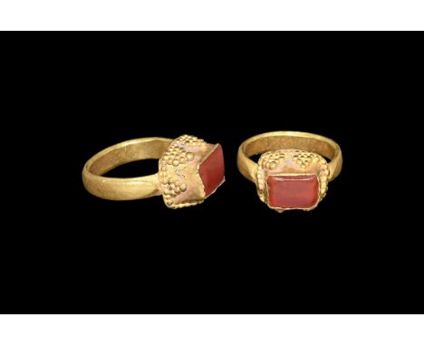 3rd-4th century AD. A flat-section gold hoop supporting a rectangular-section tapering cell with granule detailing, inset car