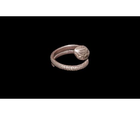 1st-3rd century AD. A silver ring in the form of a snake, body coiled round to form the ring; large head with details of the 