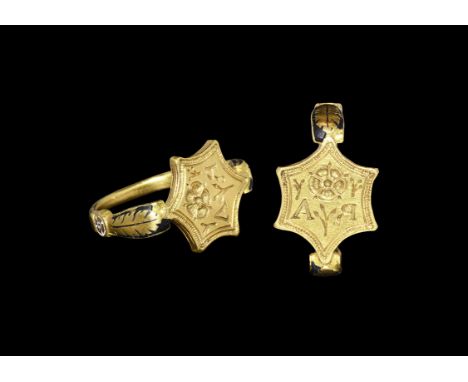 16th century AD. A D-section hoop widening to a circular boss with maltese cross against white enamel extending to acanthus l