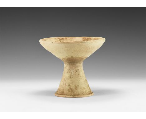 3rd millennium BC. A ceramic chalice comprising a conical foot with horizontal banding, bowl with chamfered rim.   453 grams,