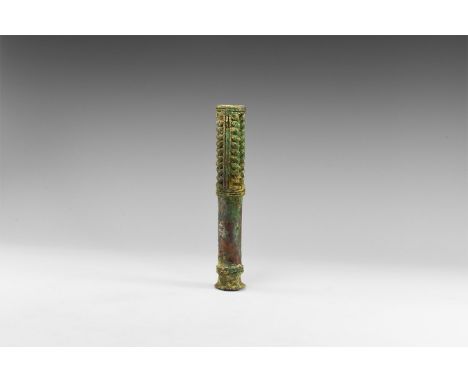 2nd millennium BC. A large tubular bronze cudgel with bands of raised ribs to the shaft, flared handle. Cf. Legrain, L. Luris