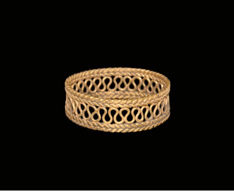 3rd century AD. A flat-section hoop formed from two outer bands of braided gold wire with a running gold wire meander between