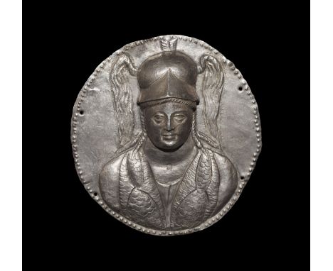 1st century BC-1st century AD. A Roman or Parthian sheet silver discoid plaque with beaded border and attachment holes; repou