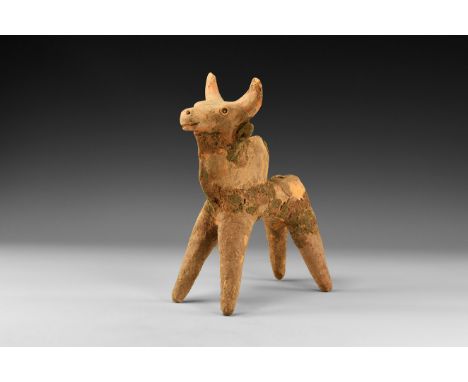 2nd millennium BC. A ceramic figure of a bull with curving horns and applied ears, incised eyes, mouth and nostrils, a large 