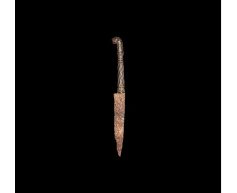 16th century AD. A knife with single-edge iron blade, bronze handle with barleytwist shank, lotus flower band to each end, pa