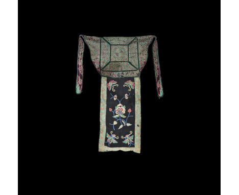 19th-early 20th century AD. A fabric panel comprising a red foundation and green geometric appliqué overlay with straps to th