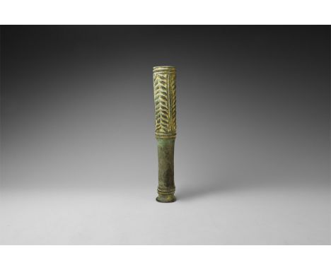 1250-650 BC. A bronze cudgel or macehead with flared base, ribbed collar above and plain handle; above three panels with repe