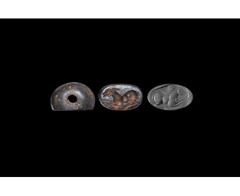 Early 1st millennium AD. A haematite stamp seal engraved with a reclining deer.   10.10 grams, 25mm (1"). Acquired on the Lon